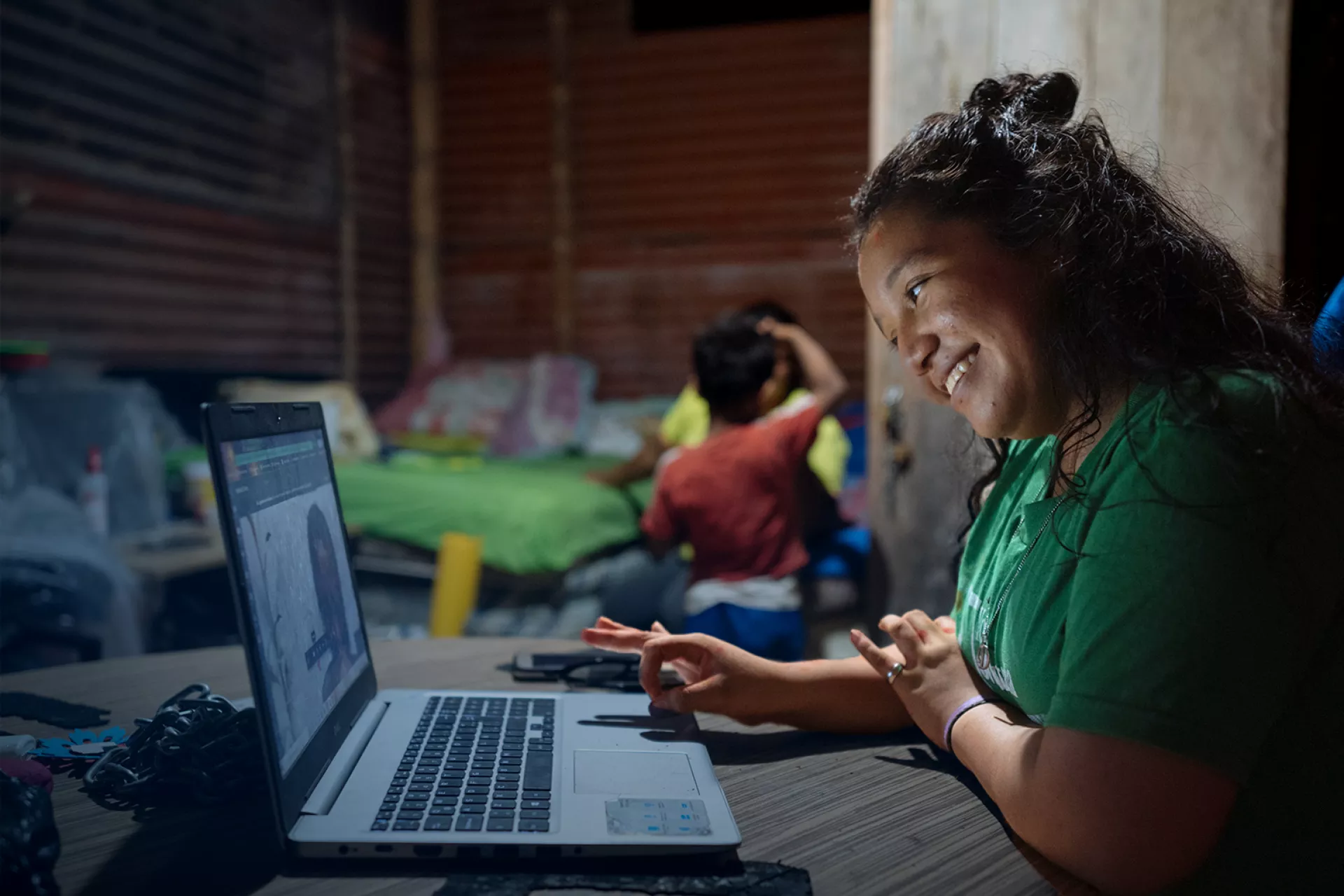 A young girl in front of a laptop