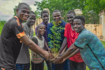 On International Youth Day, Kabiru Umar leads the youth of Sule Tankarkar in planting and nurturing saplings. His leadership and dedication encourage others to take action against desertification