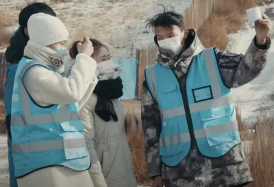 A group of young people in Mongolia engaged in measuring air quality, collaborating to assess environmental conditions and advocate for improved air quality