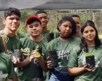 GreenRising image of young people in Brazil holding saplings