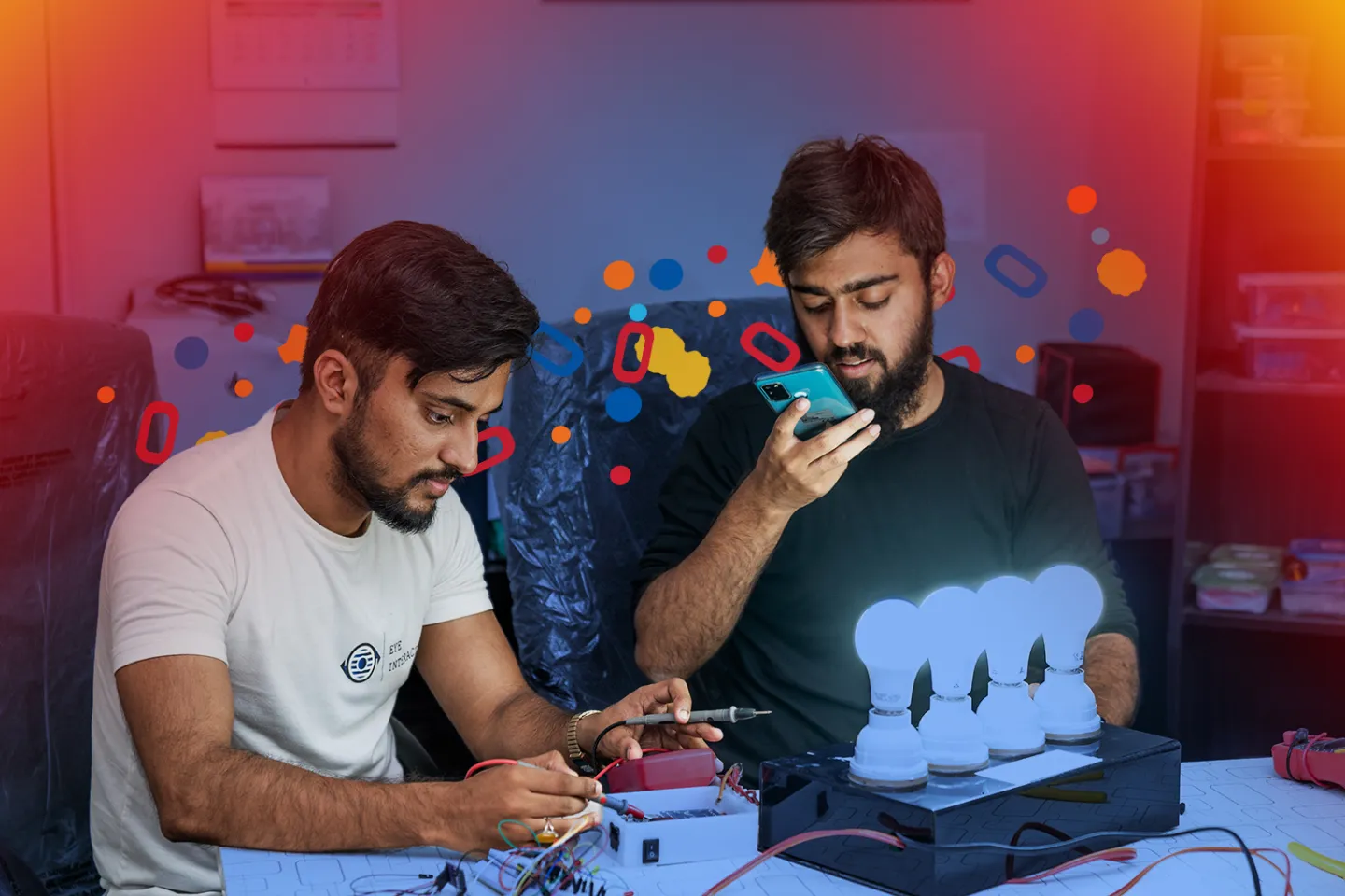 Irfan and Adeel working on their home automation system at their office in Karachi.
