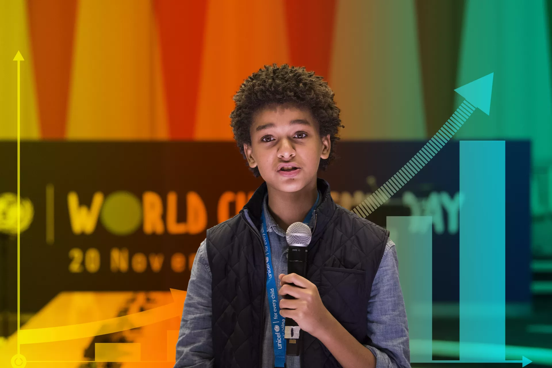 Jaden Michael, a young actor, speaks into a microphone at an event for World Children’s Day.