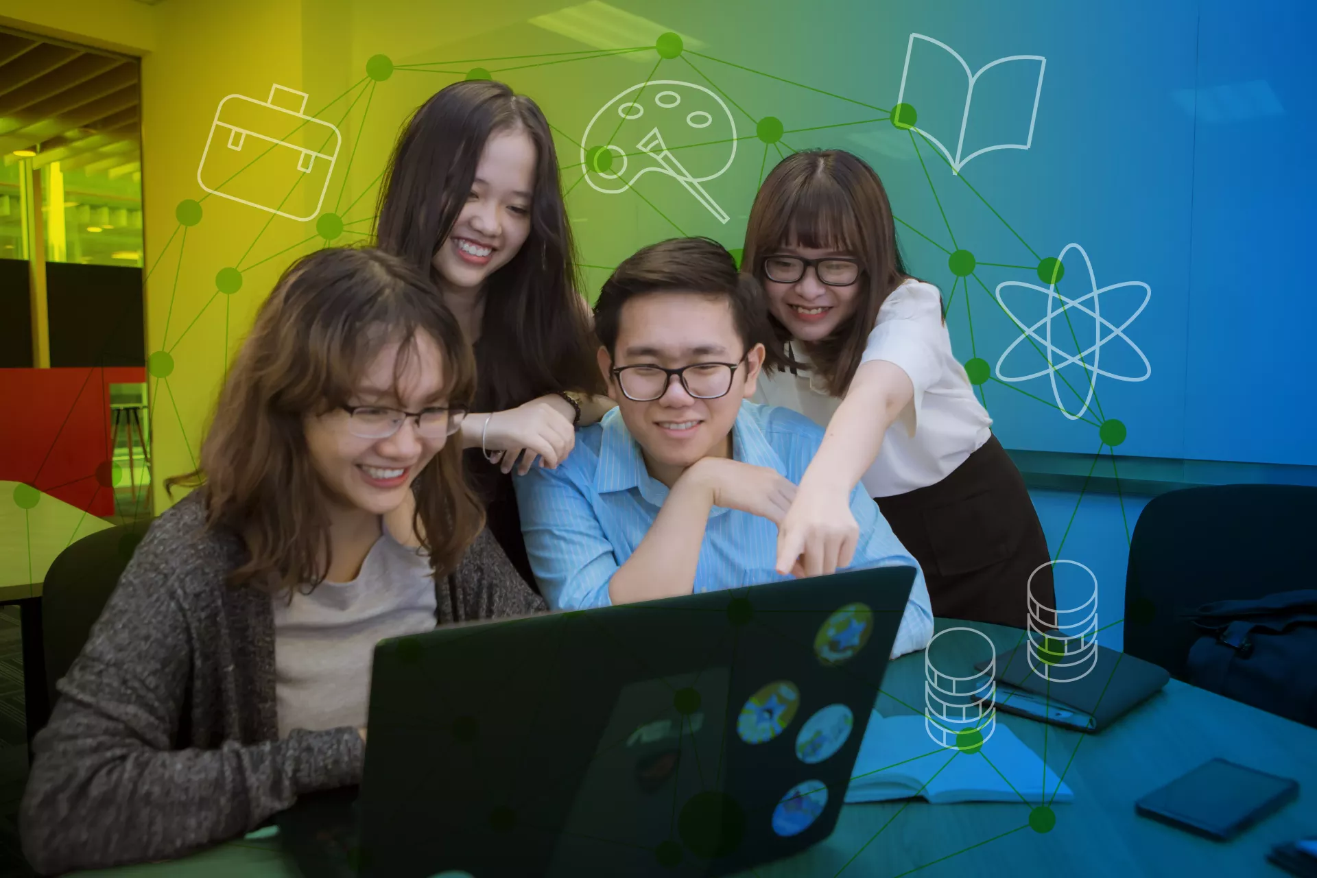 Four young people collaborate at a laptop computer in Viet Nam.