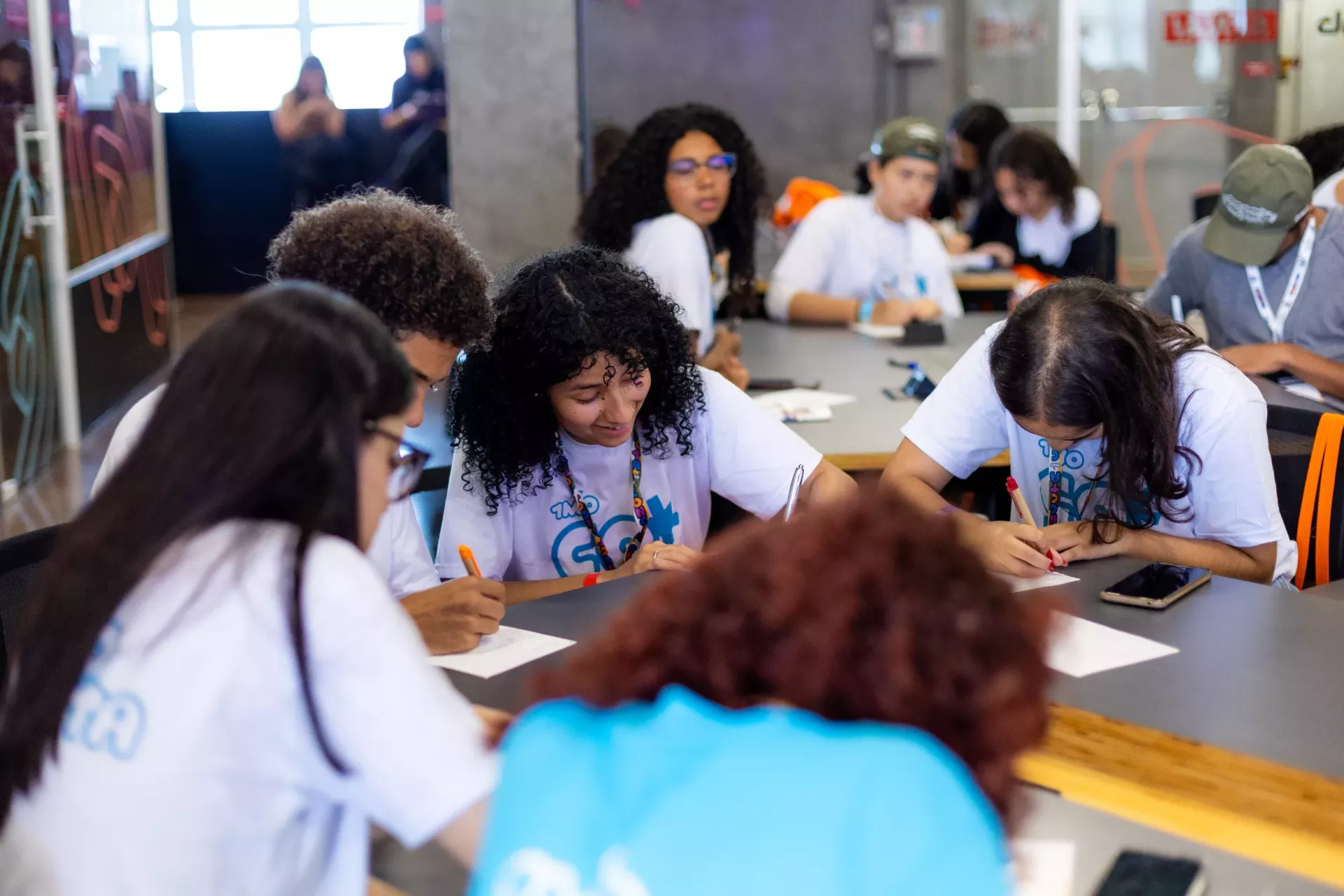 Young people learning during a job workshop in Brazil.