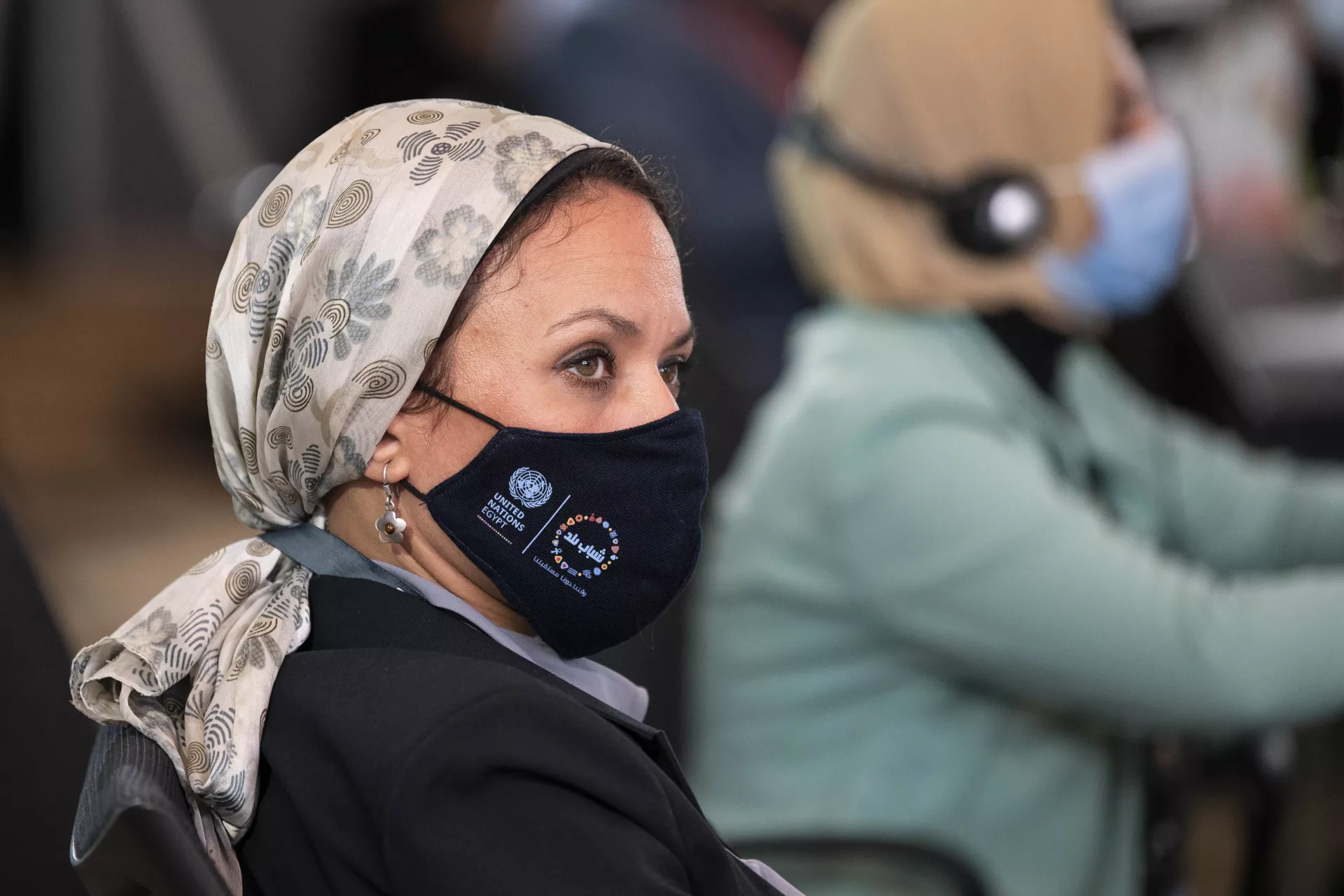 An attendee wearing a Generation Unlimited mask at the World Youth Forum
