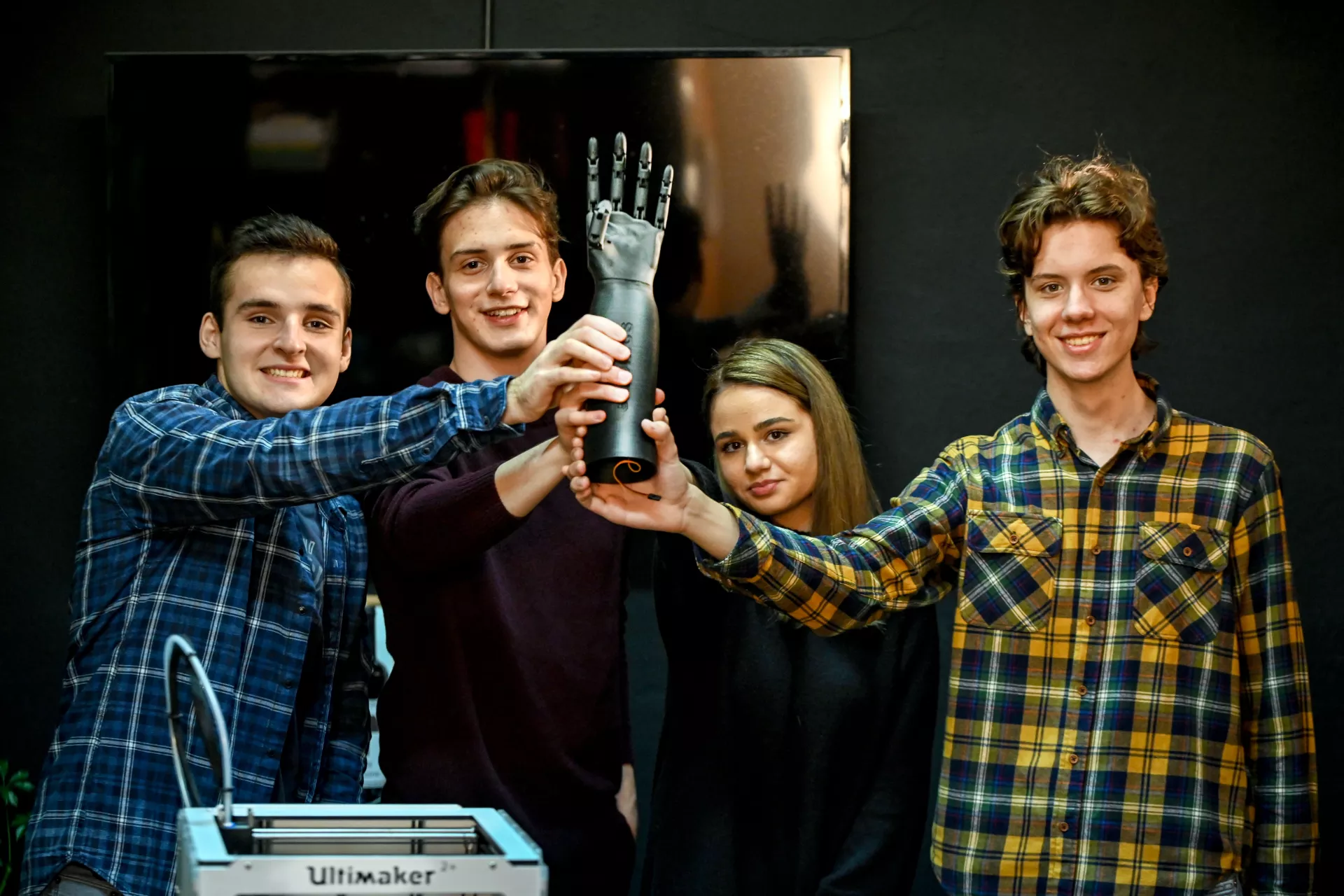 (left-to-right) Boris Nocheski, Orhan Bagashov, Anamaria Ilieva, Teo Kitanovski, posing for a picture with their bionic arm 'VenusArm'