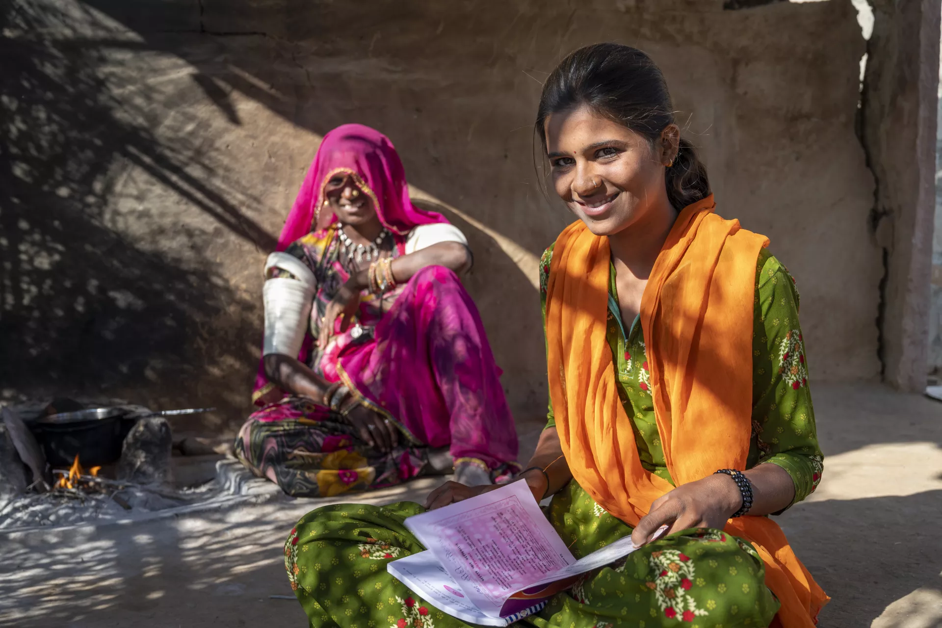 Vira (16) studies at home during covid 19 . she uses tradional books and mobile education. Location : Sanwlor Village, Barmer, Rajasthan, India