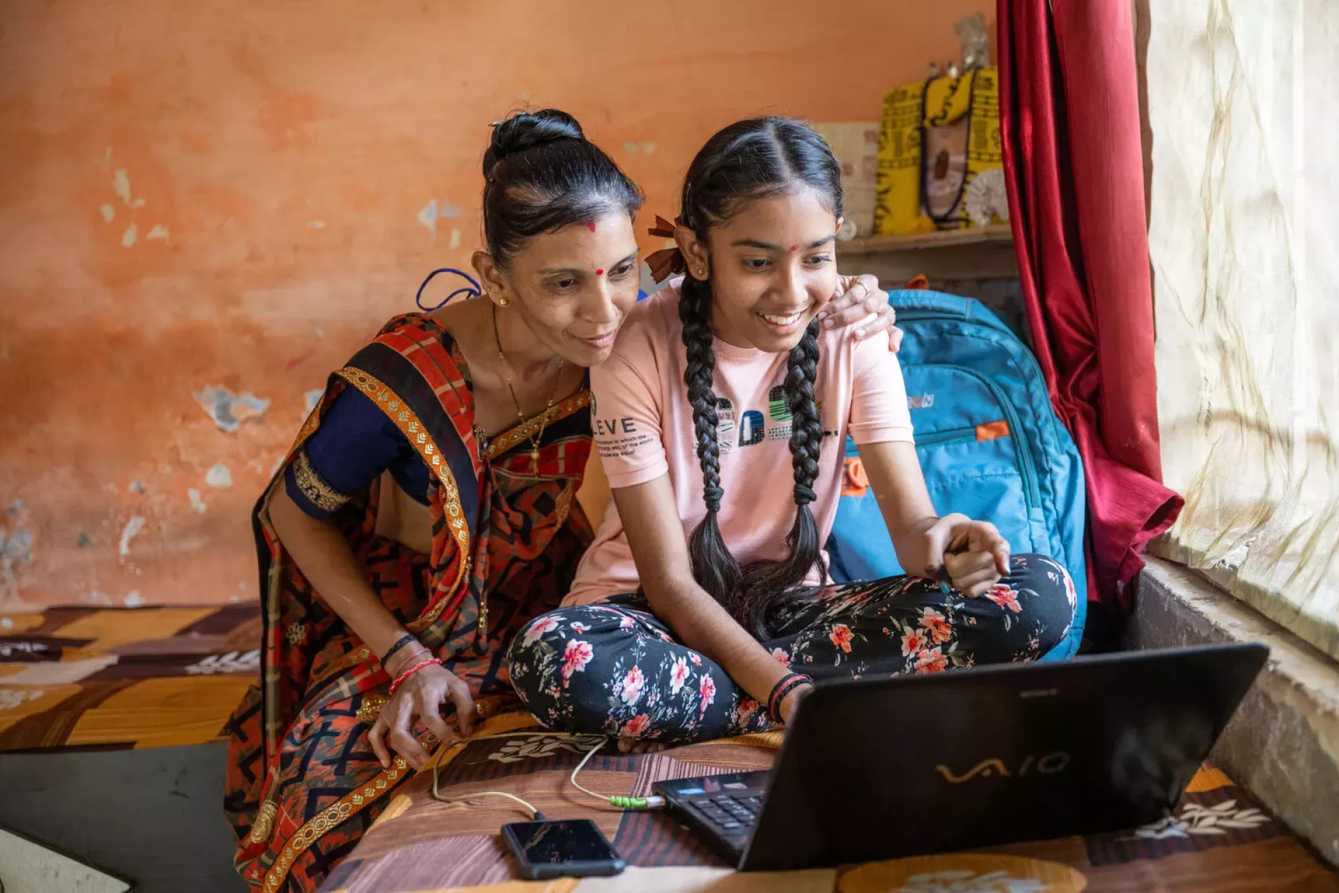 Harshita Rawal (14 years) undetakes the P2E program at home and school.Her family is happy to see the changes in her. &nbsp;Shivam Vidyalaya has adopteed Passport To Earning (P2E) progame launched by YuWaah@unicef . It is a digital plaftorm where students undertake &nbsp;self paced courses on life skills, digital productivity and financial literacy. Students can do the course at home on mobile or laptops and also at school. Location : Shivam Vidyalaya , Nava Naroda, Ahmedabad.