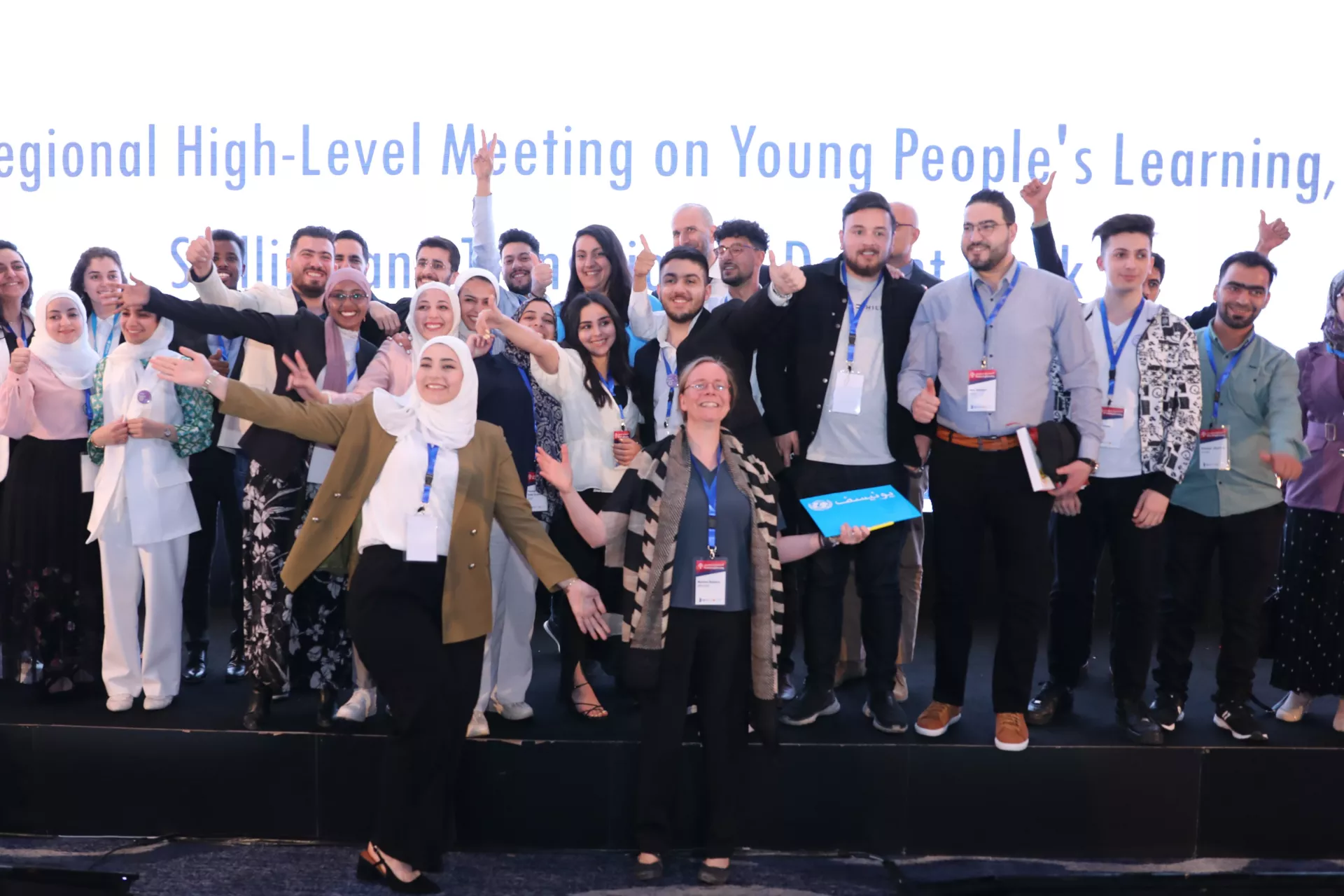 Participants of Regional High-Level Meeting on Young People’s Learning, Skilling and Transition to Decent Work pose on stage