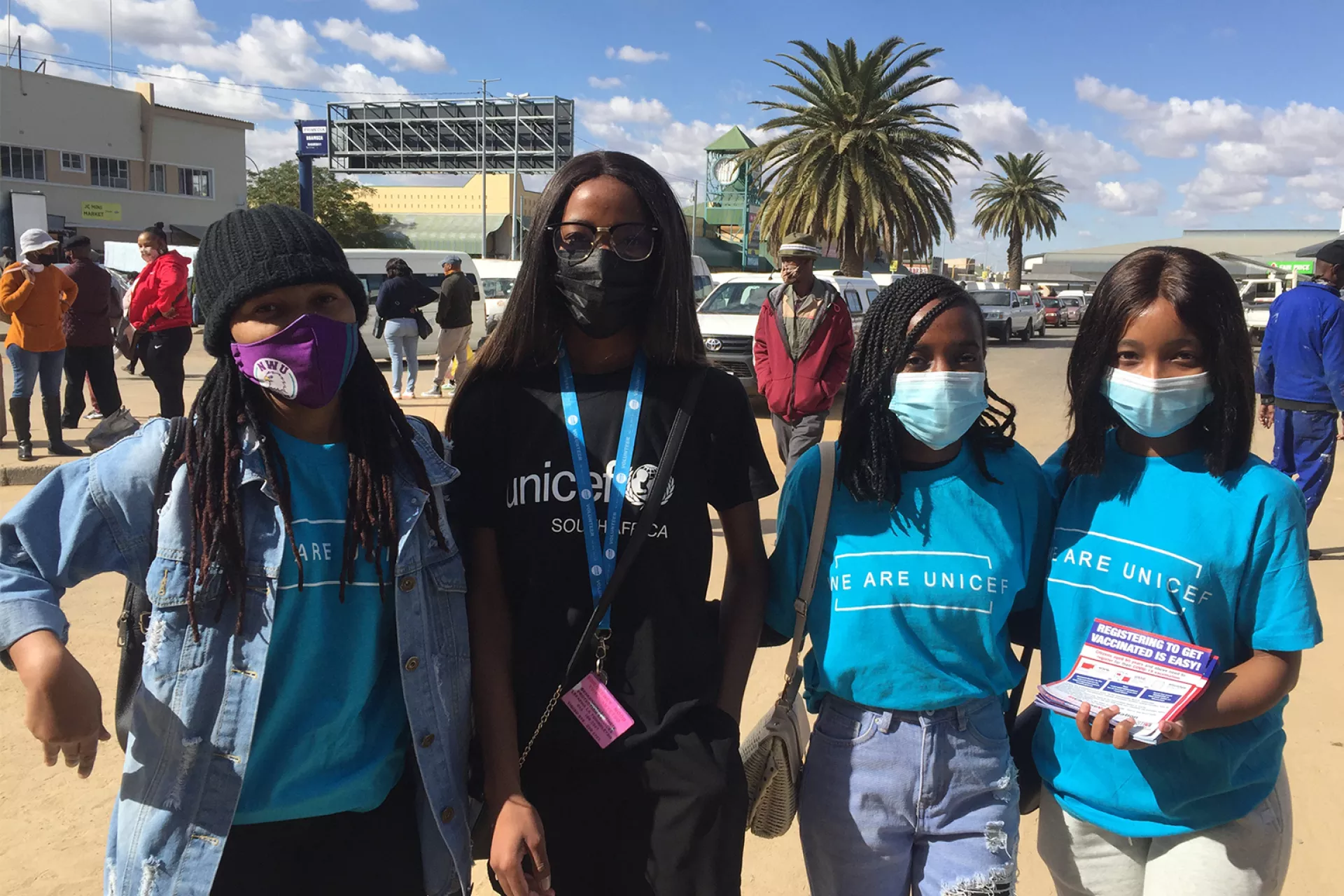 A group of young volunteers wearing UNICEF shirts on a street in South Africa