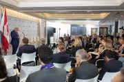 A man speaks to a crown at th Canadian Consulate