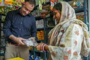 Kevin Frey visits a Kirana store in India, speaking with a store owner supported through YuWaah's Didi Ki Dukaan initiative.