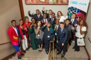 Young people from the GenU Livelihoods Showcase all wave for a photo
