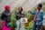 Grace engaging with farmers and learners.