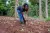 Grace puring soil in the farm field. 