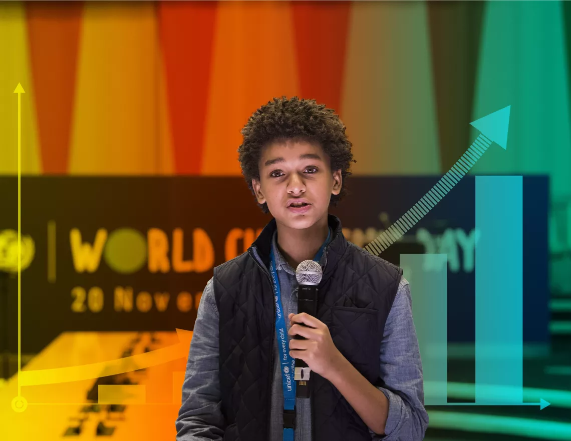 Jaden Michael, a young actor, speaks into a microphone at an event for World Children’s Day.