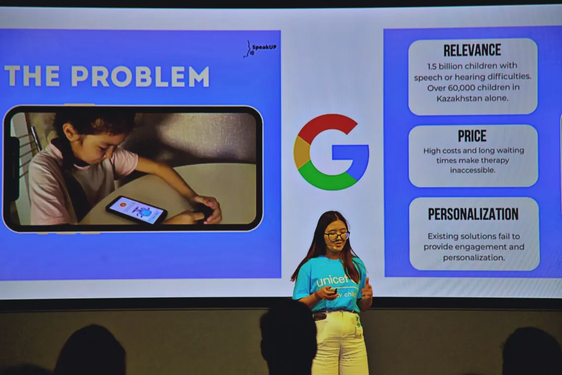 Presenter speaks in front of a slide titled 'Problem' with Google logo and bullet points.