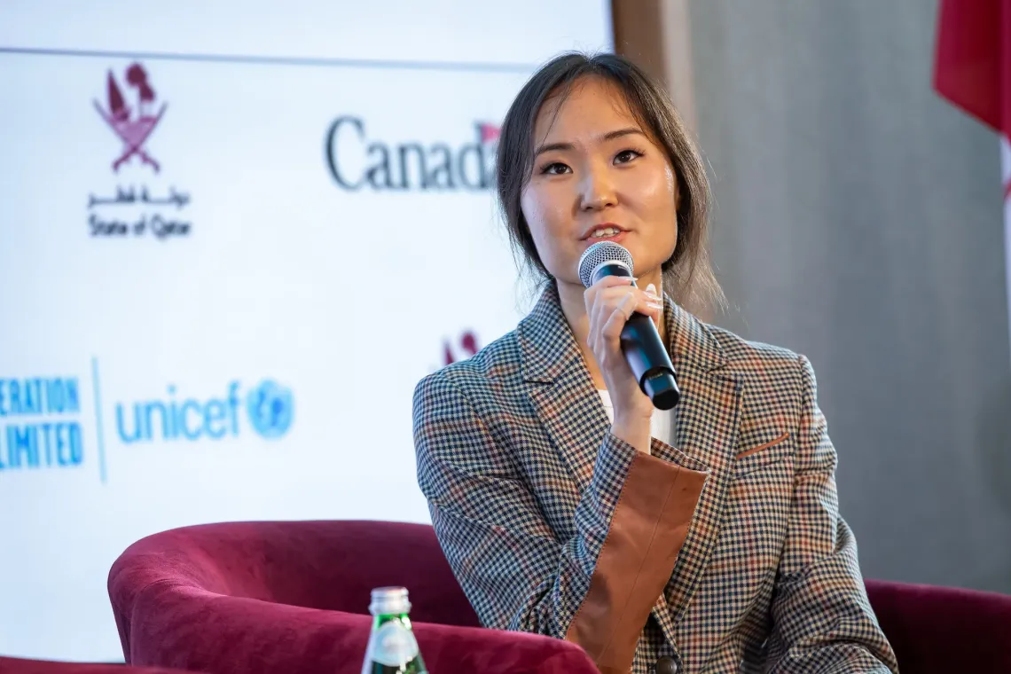 Photo of Naranzaya on stage during a panel discussion at the Global Leadership Council
