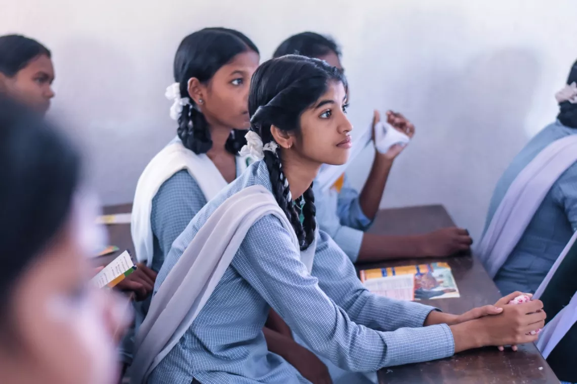 Portrait of a young Indian girl in a classroom setting