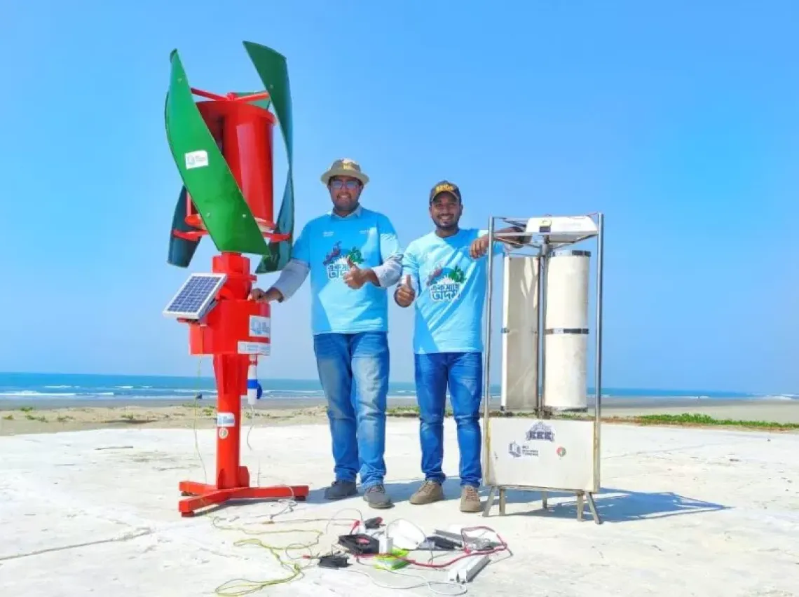 Bangladesh BD Highway Turbine team members showing their project. 