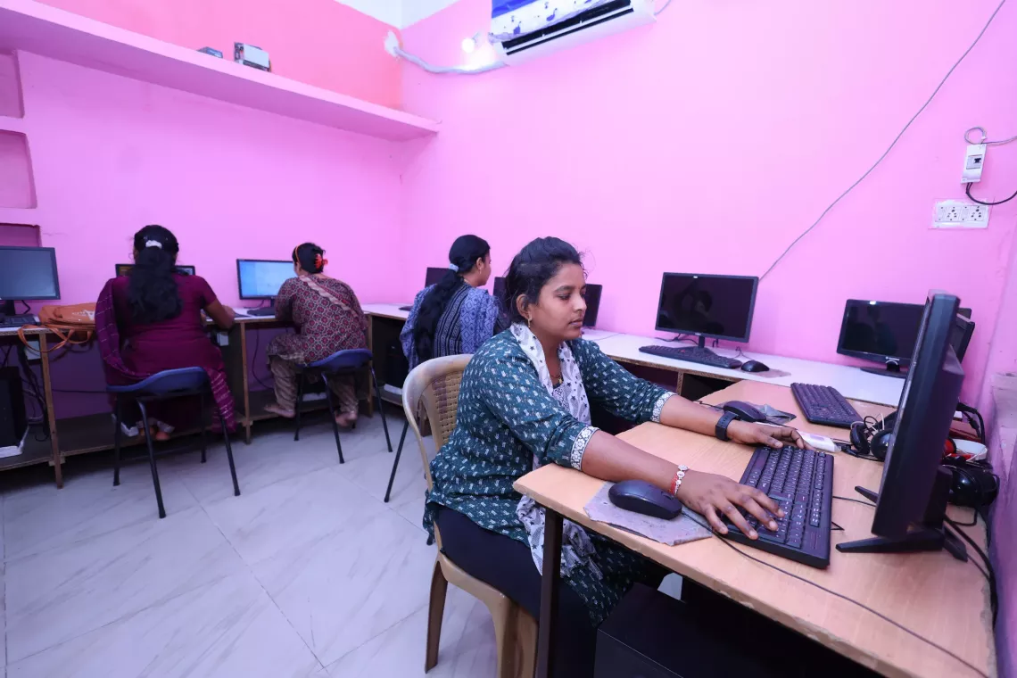 Priti Manjari Sahu, is at school using a computer to learn 