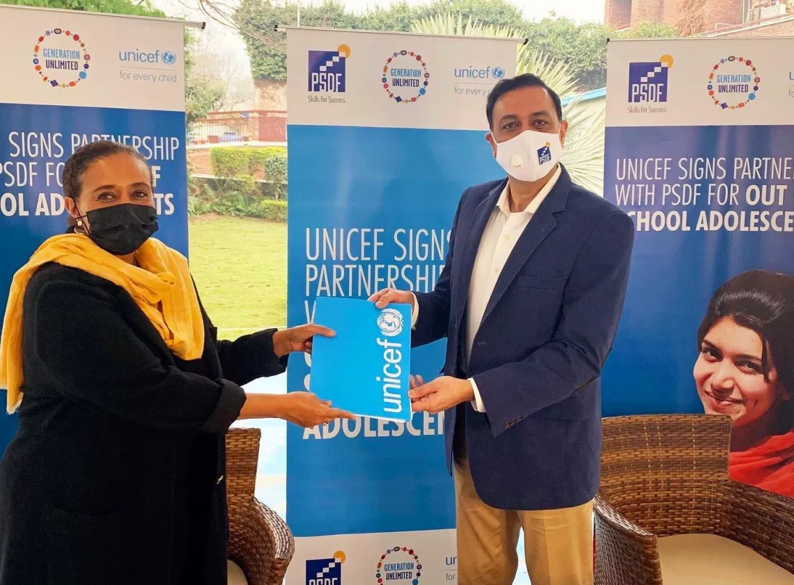 UNICEF Representative in Pakistan Aida Girma and PSDF CEO Jawad Khan signing a partnership agreement as part of GenU