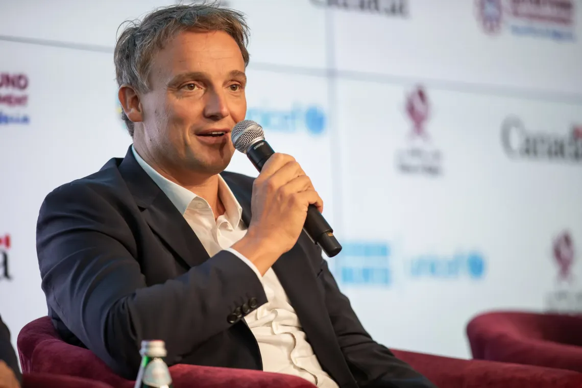 Christian Klein speaking on stage