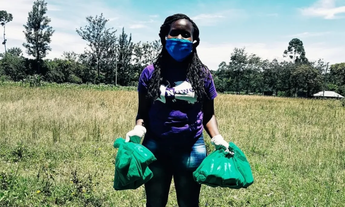 Natalie holdling menstrual health care packages that they are giving away.