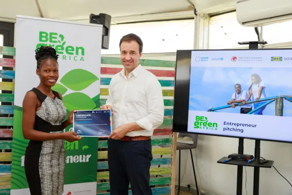Kevin Frey and young entrepreneur in Kenya awarding certificate