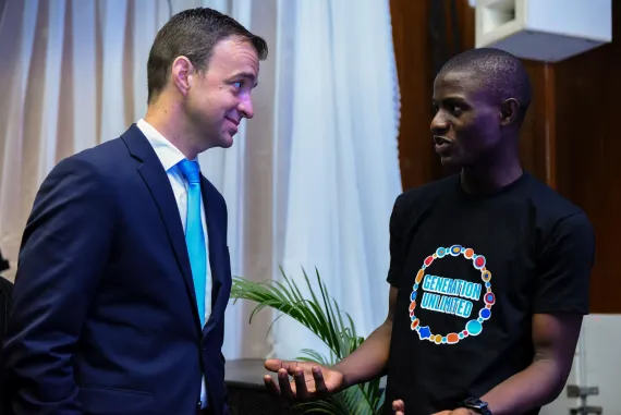 Kevin Frey engages with a young person in Nigeria in 2021, listening to their experiences, aspirations, and ideas for the future.