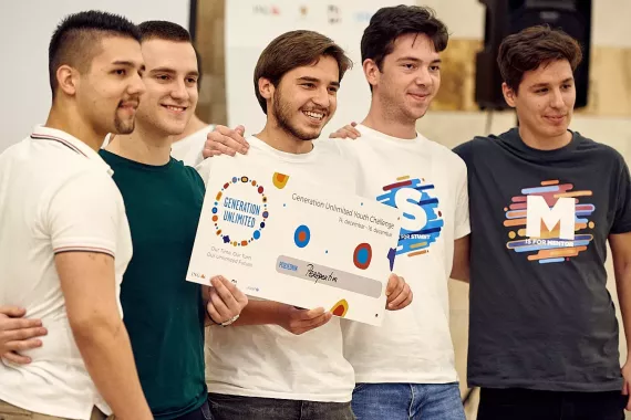 A team of young accept their award at the Generation Unlimited Youth Challenge in Montenegro.