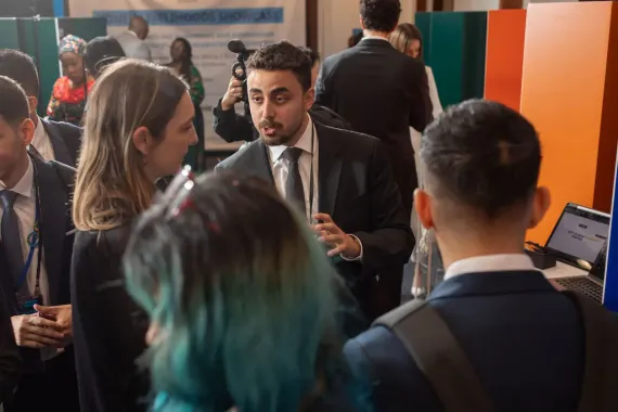 Bryan Youssef MD, Founder of EduBolt from Lebanon, listening attentivelty during a gathering.