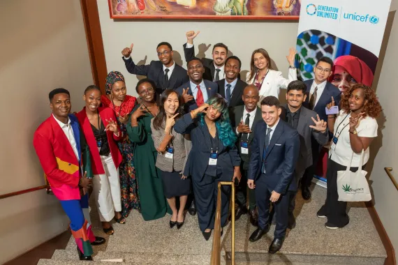 Young people from the GenU Livelihoods Showcase all wave for a photo